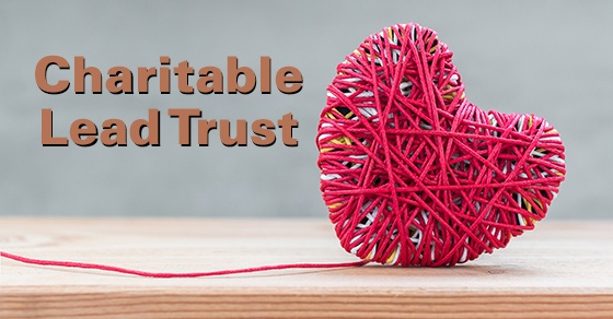 A heart made of string sits on a table with the words Charitable Lead Trust next to it.